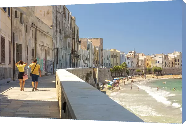Trapani, Sicily. Seascape of the town with people walking on the baroque street