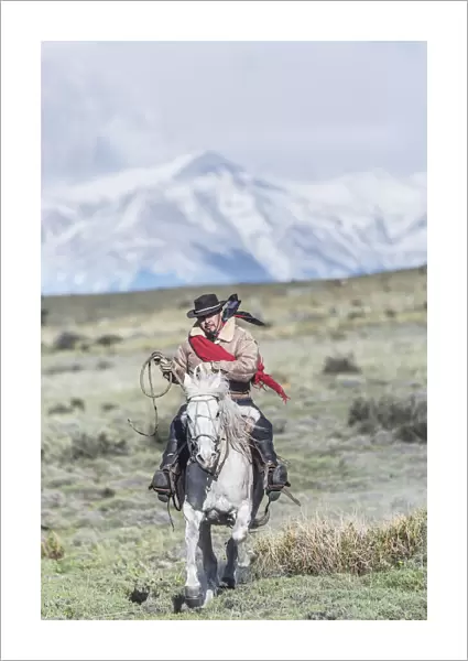 Cowboy on horseback, Torres del Paine National Park, Chile, MR