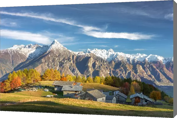 Alpine village of Cermine with view on snowcapped mountains