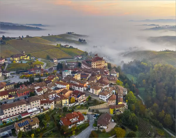 Aerial view of Falletti Castle and Barolo at sunrise during autumn, Cuneo, Langhe e Roero