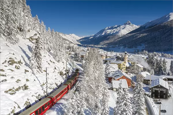 Bernina Express passes in Madulain, Graubunden, Maloja, Switzerland, Europe