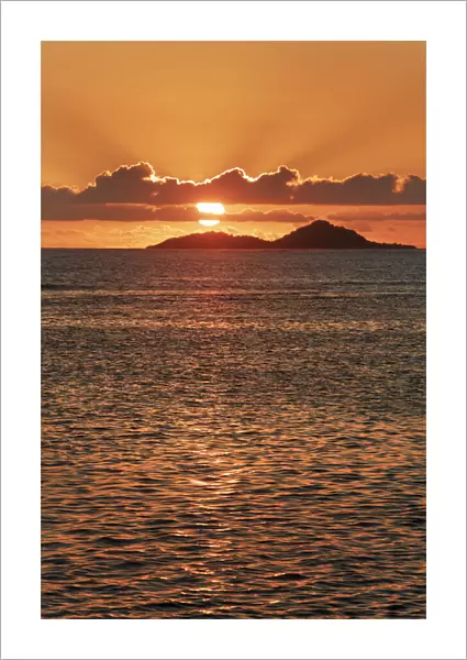 Sunset impression with island - Seychelles, Praslin, Anse Bateau - Indian Ocean