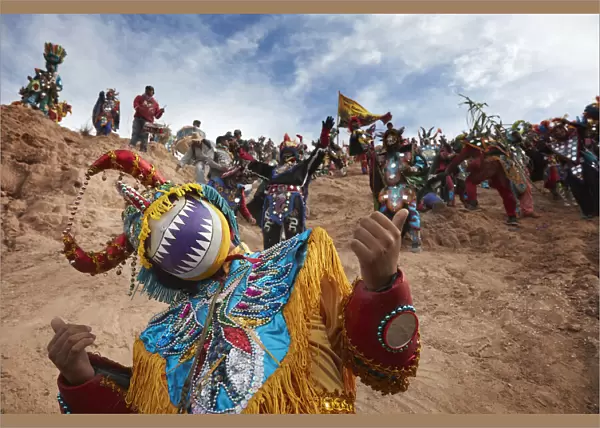 The 'Descent of the Devil's' from the sacred 'Cerro Blanco' hill in Uquia, Jujuy, Argentina. Hundreds of devils descend from the 'Cerro Blanco' hill to celebrate the start of Carnival