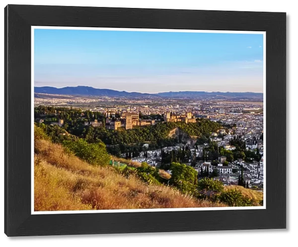 Cityscape with elevated view of Alhambra, sunset, Granada, Andalusia, Spain