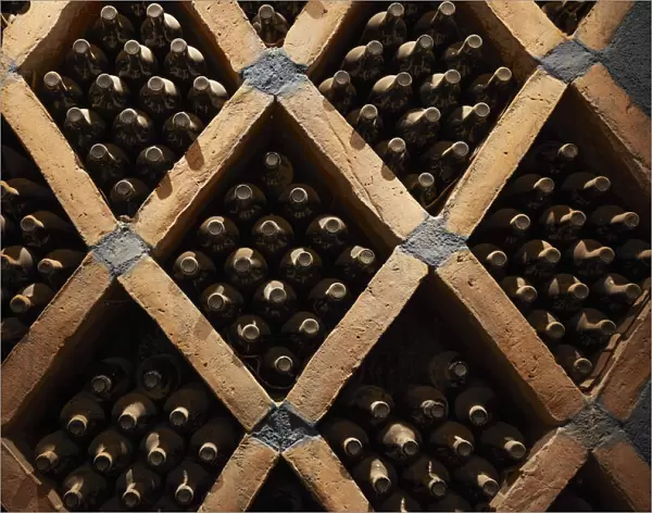Vintage wine bottles in the cave of the Bodega 'Las Arcas de Tolombon' winery, Colalao del Valle, Calchaqui Valleys, Tucuman, Argentina