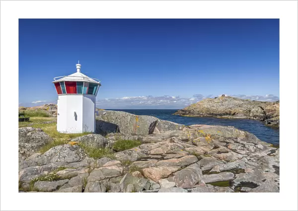 Small lighthouse in the harbor of Landsort on the archipelago island of Oja