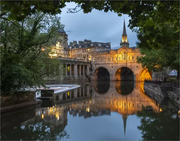 Reflections of Pulteney Bridge in the River Avon at twilight, Bath, Somerset, England