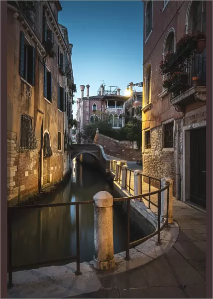Venice, Veneto, Italy. Tiny alley in Dorsoduro at dusk