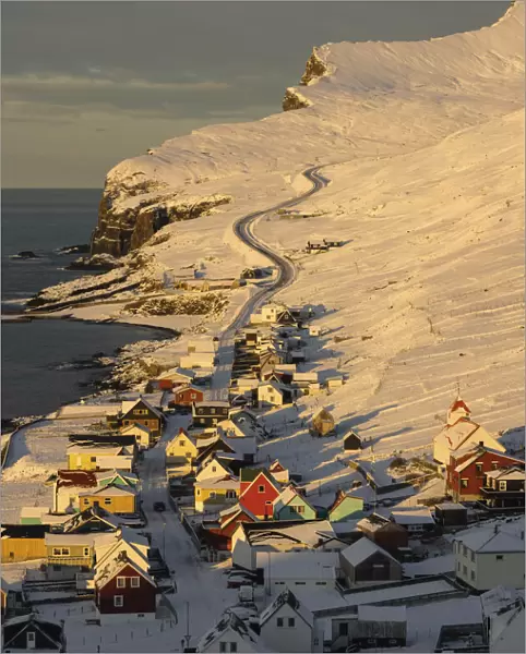 The village of Sumba covered by snow at sunrise. Island of Suðuroy. Faroe Islands