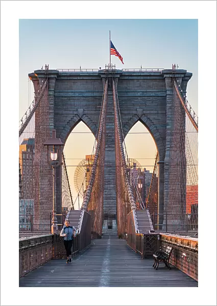 running on New York City Brooklyn Bridge at Sunrise, USA