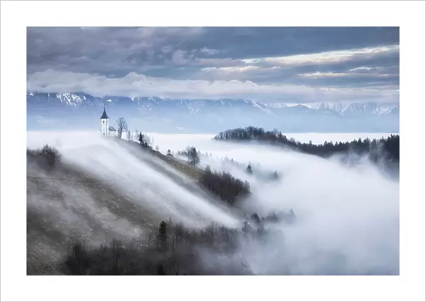 Cloud inversion around Church of St. Primoz, Jamnik, Slovenia