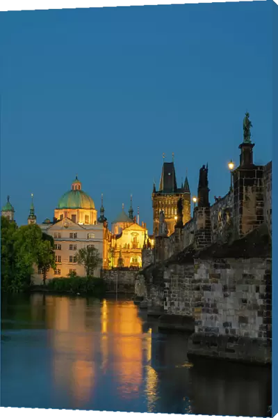 St. Francis Of Assisi Church and Old Town Bridge Tower at Charles Bridge at twilight, Prague, Bohemia, Czech Republic