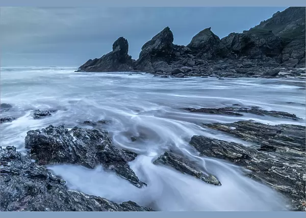 Stormy evening on the dramatic shores of Soar Mill Cove in the South Hams, Devon, England. Winter (December) 2019
