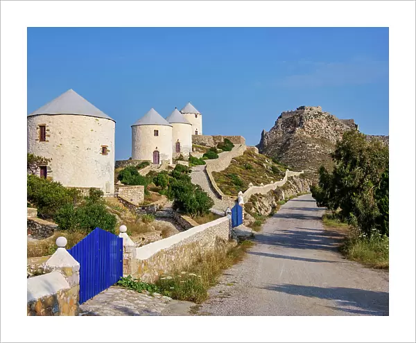 Windmills of Pandeli with Medieval Castle in the background, Leros Island, Dodecanese, Greece