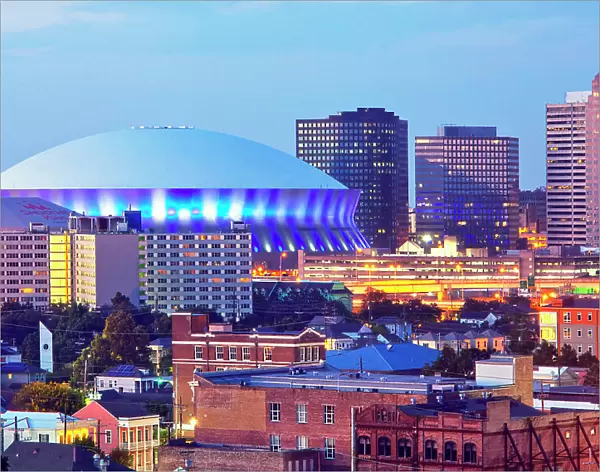 The Superdome, a multi-purpose stadium and home to the New Orleans Saints football team, is illuminated at dusk in the city of New Orleans, Louisiana, USA