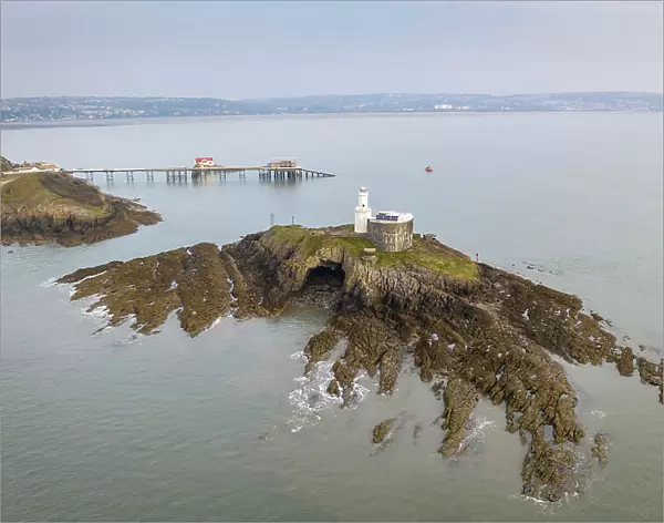 Aerial view of Mumbles Lighthouse and Pier at the eastern edge of the Gower Peninsula, Swansea, Wales, UK. Spring (March) 2022