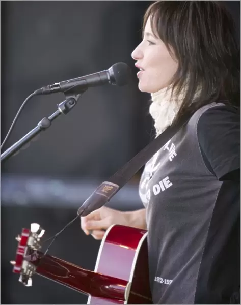 Musician K T Tunstall playing for the crowds at the I Count Climate Change rally in Trafalgar Square