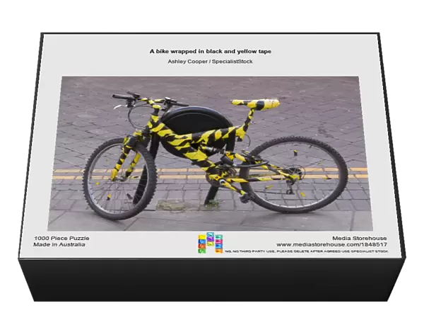 A bike wrapped in black and yellow tape