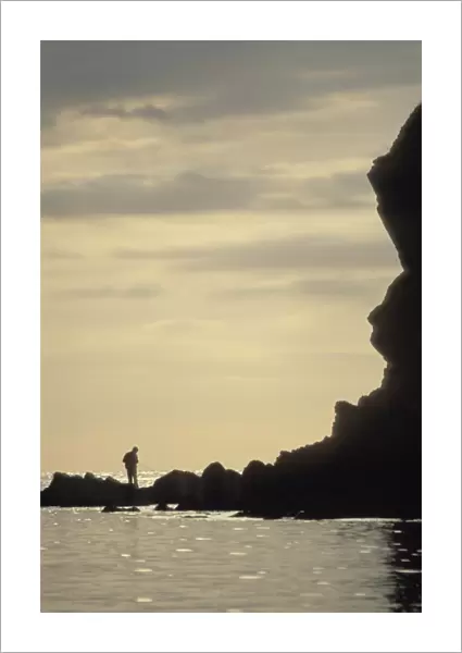 Silhouette of fisherman, Porthlysgi Bay, Pembrokeshire, Wales, UK, Europe (rr)