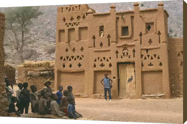 20040117. MALI Architecture Dogon village Elders house with man standing outside