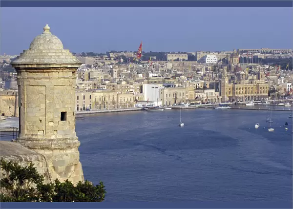 20064713. MALTA Vittoriosa View of fortification sentry post overlooking harbour and town