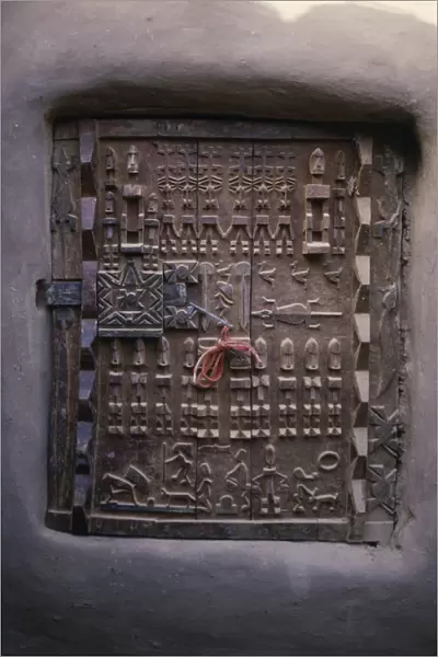 20074019. MALI Bandiagara Escarpment Sangha Detail of carved granary door