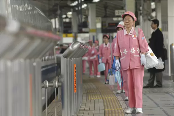 Japan Tokyo Middle aged woman part of cleaning crew