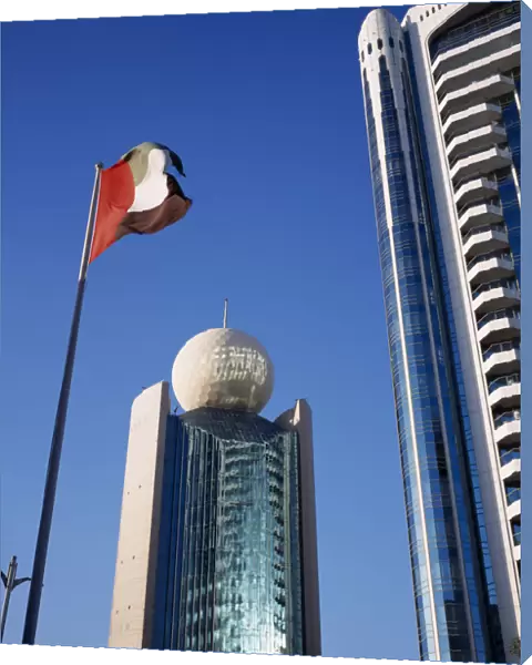 UAE, Dubai, Deira Etisalat Building on Dubai Creek with flag pole in foreground