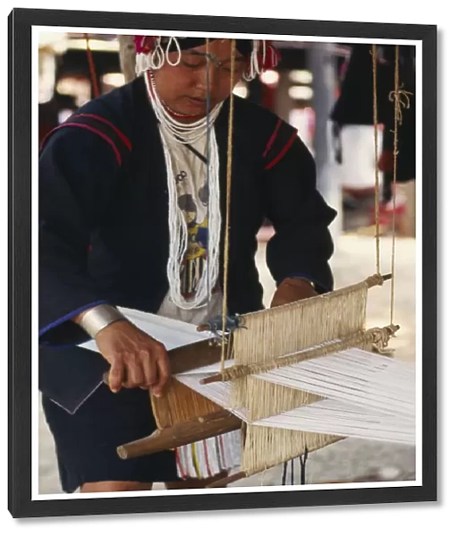 20063646. THAILAND Chiang Mai Province Akha woman weaving cloth on an Akha loom