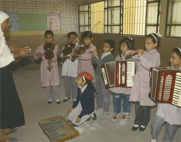 20004469. EGYPT Cairo Childrens music lesson in state school