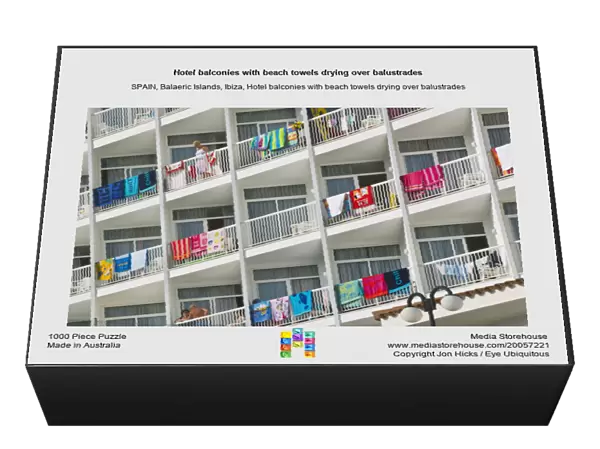 Hotel balconies with beach towels drying over balustrades