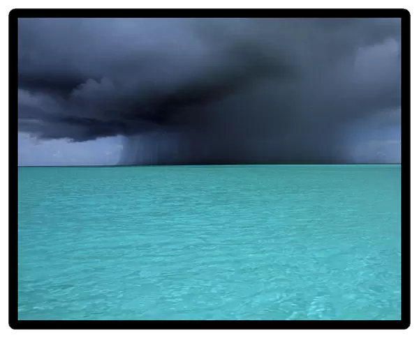 20078766. WEST INDIES Turks and Caicos Island Storm clouds over the ocean