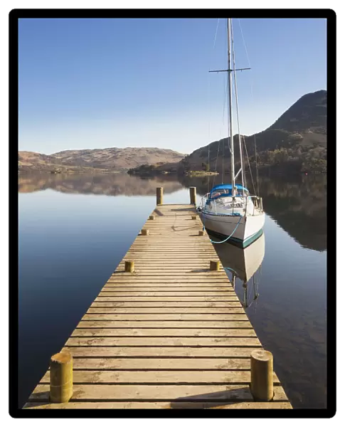 Yacht moored at a jetty on Lake Ullswater, Glenridding, Lake District, Cumbria, England