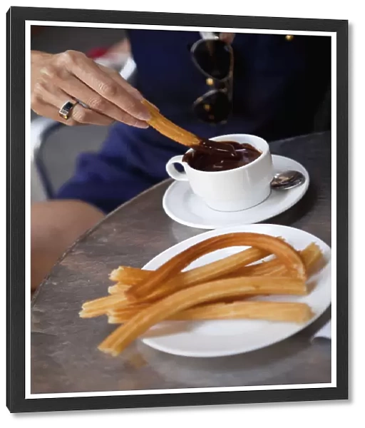 Spain, Madrid, Eating churros with hot chocolate