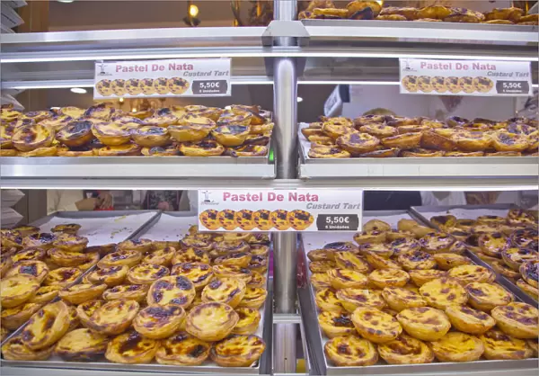 Portugal, Estremadura, Lisbon, Baixa, Display of custard cakes and pastries