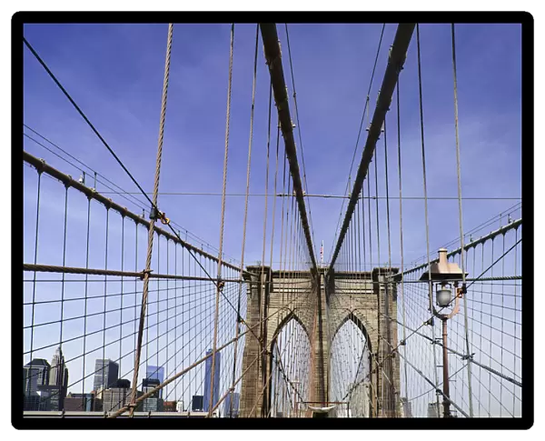 USA, New York, Brooklyn Bridge. View across bridge towards Manhattan skyline part framed