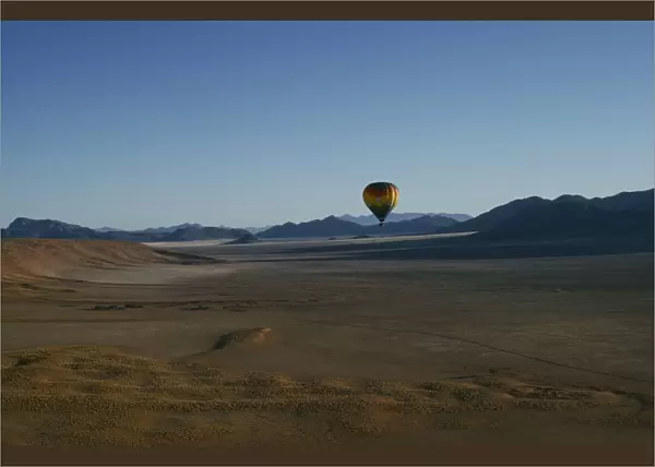 20066175. NAMIBIA Namib Rand Reserve Hot air balloon above Camp Mwisho