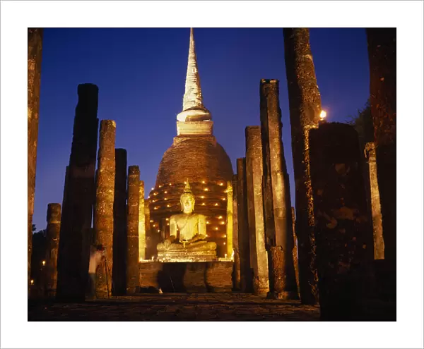 20081253. thailand, sukhothai, colonnade leading to massive seated buddha