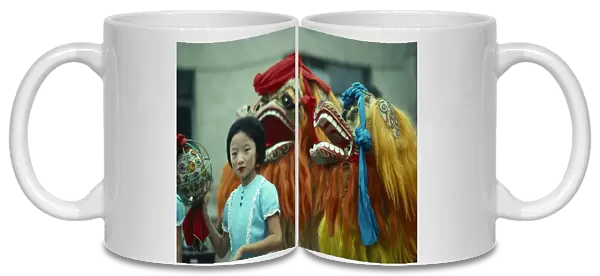 China, General, Chinese New Year Dragon dancers and young girl