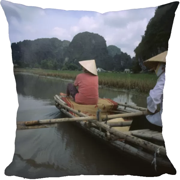 20046597. VIETNAM North Hoa Lu Two women rowing bamboo canoe