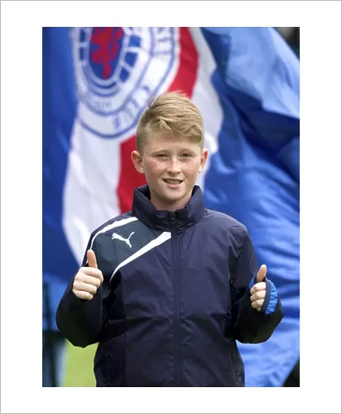 Rangers FC: A Fan and Ball Boy Amidst the Thrills of the Ladbrokes Championship Match at Ibrox Stadium