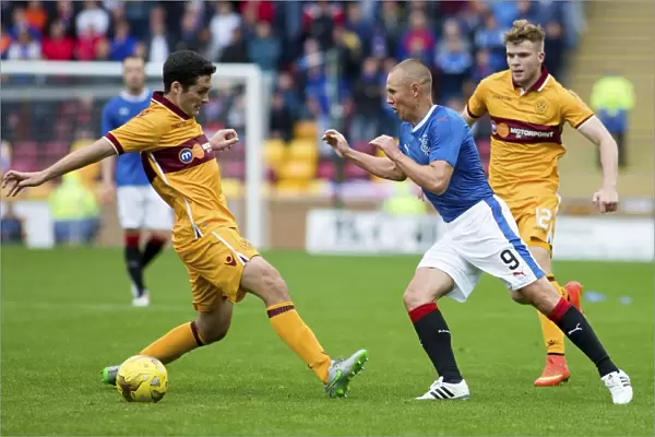 Rangers Kenny Miller Evades Carl McHugh: Intense Moment from Betfred Cup Clash at Fir Park