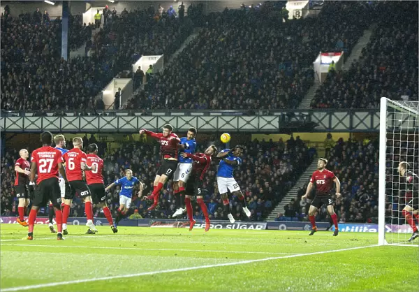 Rangers in Action: Goldson and Morelos Leap for the Ball in Ladbrokes Premiership Clash at Ibrox