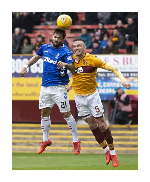 Clash at Fir Park: Candeias Soars Over Aldred