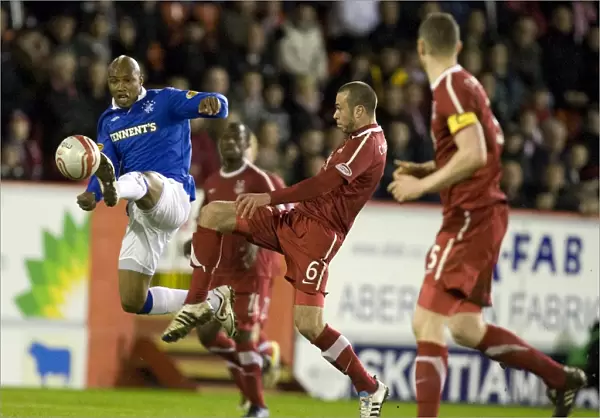 Diouf Scores the Opener: Rangers vs. Aberdeen at Pittodrie Stadium (Clydesdale Bank Scottish Premier League)