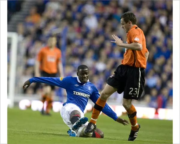 Rangers vs Dundee United: Maurice Edu Tackles Keith Watson - Ibrox Stadium, Clydesdale Bank Scottish Premier League - Rangers Lead 2-0