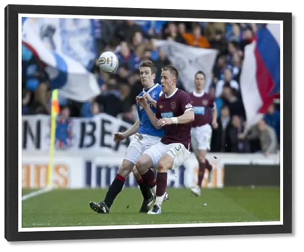 Thrilling Scottish Premier League Clash: Stevenson Scores the Winner for Hearts over Davis and Grainger's Rangers (1-2)