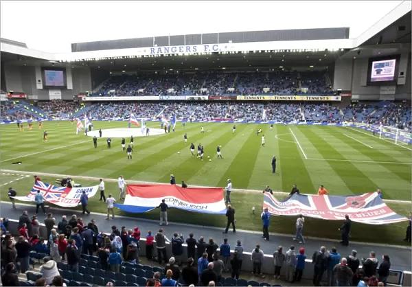 Rangers Fans United: A Sea of Flags at Ibrox Stadium - Passionate Rangers Supporters Rally During the Scottish Premier League Match