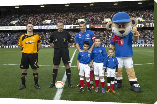 Rangers Triumph: Lee McCulloch and Mascots Celebrate Historic 7-0 Scottish Cup Victory at Ibrox Stadium