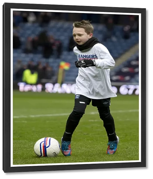 Rangers football in the community kids on the pitch at half time